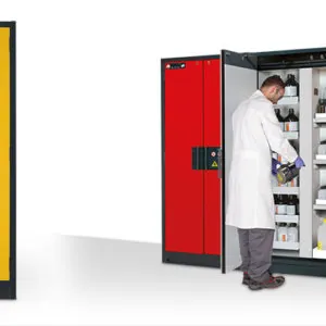 Red flammable storage cabinet opened by a laboratory technician